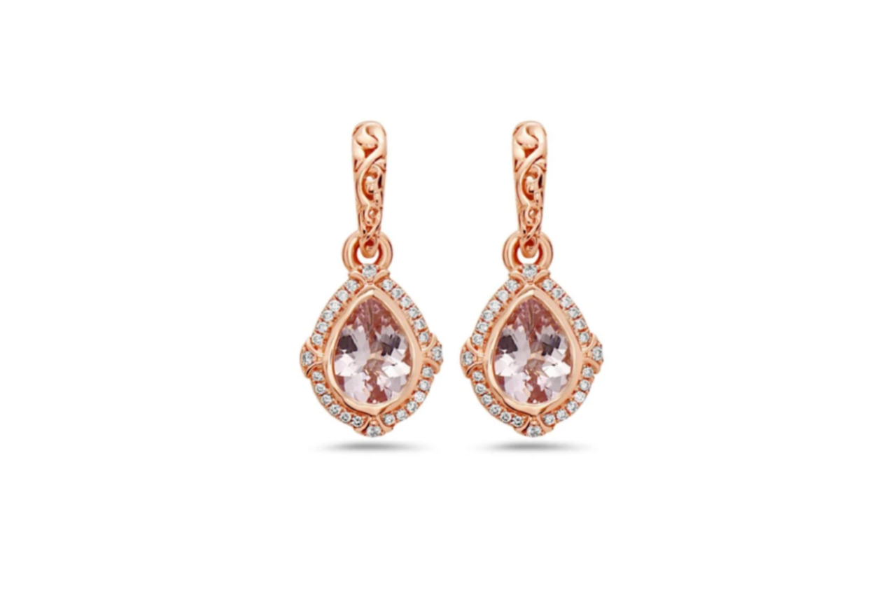 A pair of ornate pear shaped drop earrings in rose gold.