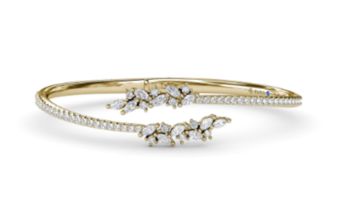 A yellow gold and diamond Fana bangle with nature-inspired diamond accent, available at Windsor Jewelers.