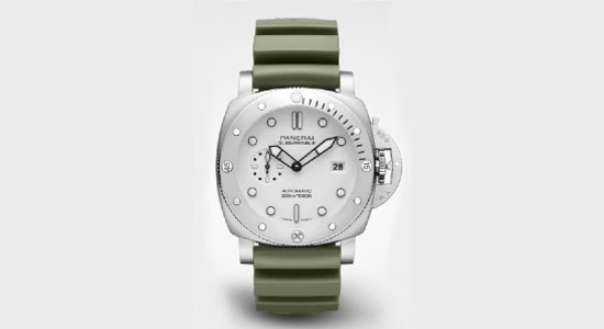 a white gold watch from Panerai with a green strap