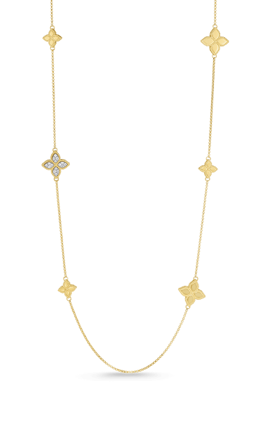 A yellow gold station clover necklace