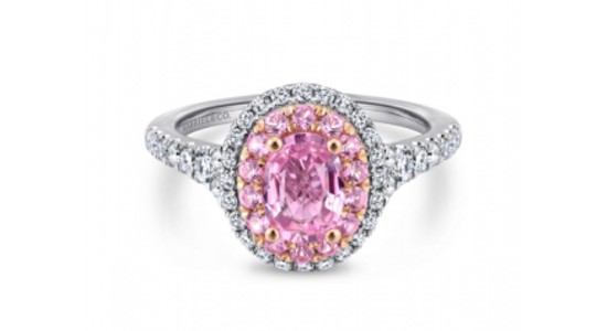 a white gold engagement ring with a pink center stone and diamond accent stones