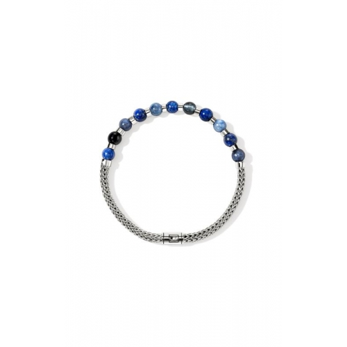 Silver chain bracelet with round blue and black stones arranged on top.